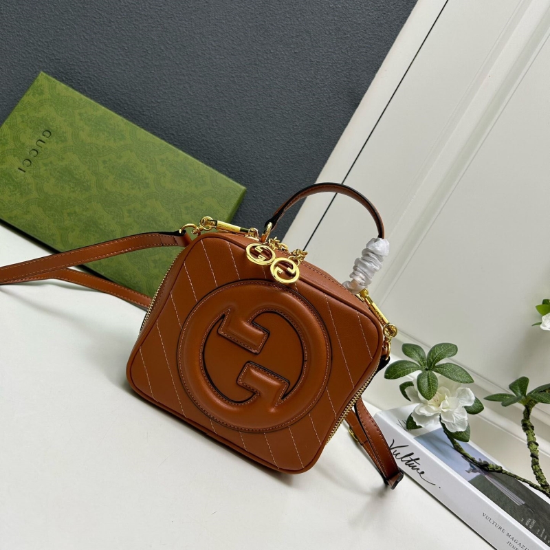 G*u*i top handle bags